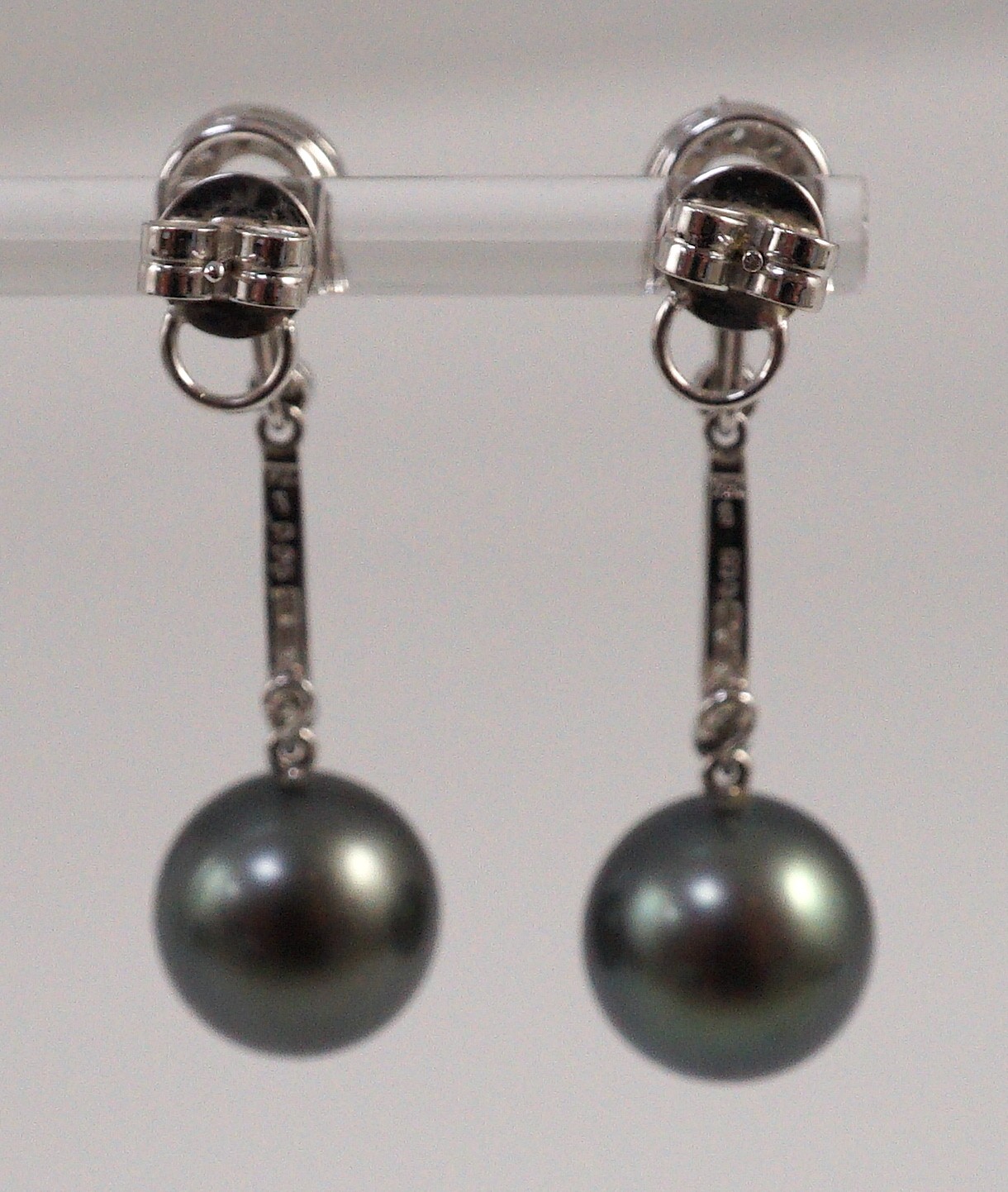 A modern pair of single stone South Sea Tahitian pearl style and diamond chip set drop earrings